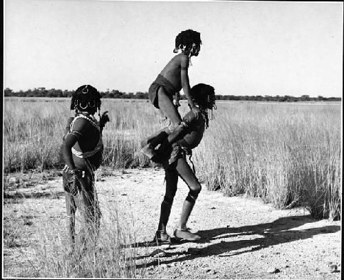 Three girls playing a game at the edge of Gautscha Pan