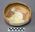 Restorable Awatovi black-on-yellow pottery bowl