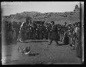 Circle of tribal people with chicken