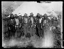 Tribal men in front of tent