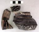 Ceramic rim & body sherds, flared lip, red & white pigment, mended, metal attach