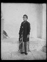 Young man standing in traditional dress