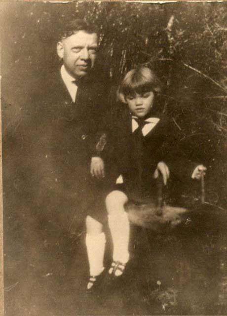 Husband of M.E. Copeland with child on lap