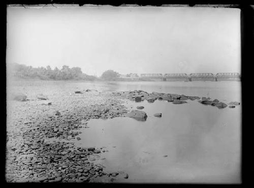 Pennsylvania shore of river looking upstream NNW, railroad bridge in distance.