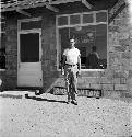 Man standing outside a cafe