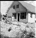 A man standing in front of a building