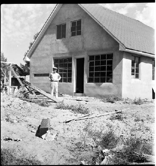 A man standing in front of a building