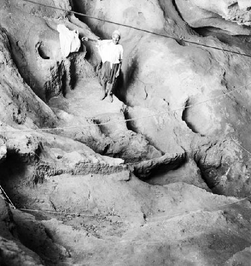 Man stands at excavation site