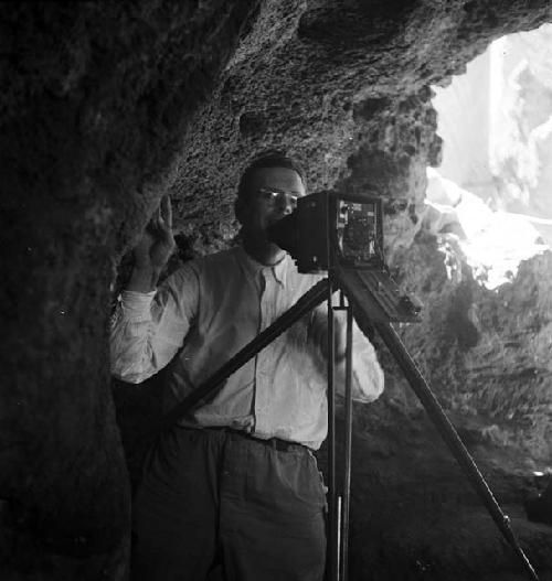 Man takes pictures at excavation site