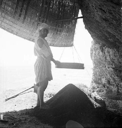 Man stands at excavation site