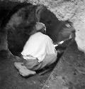 Man sits at excavation site