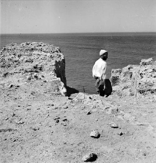 Man stands at excavation site