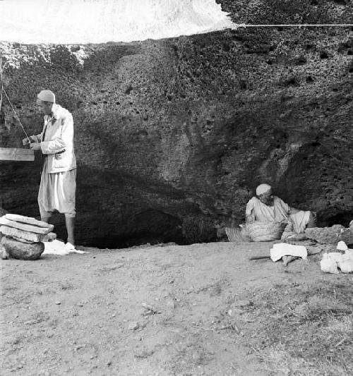 Two workers in excavation