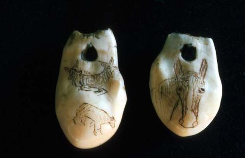 Bone or tooth beads with incised designs