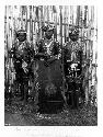 Three boys standing in Bagobo warrior dress