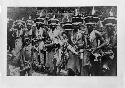 Men and children posed in costume for dance