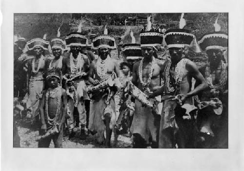 Men and children posed in costume for dance