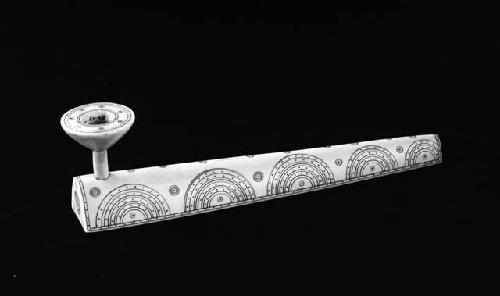 Pipe decorated with etchings