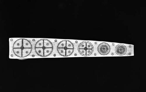 Bottom view of pipe decorated with etchings