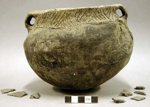 Ceramic vessel, 2 handles, incised rim, 9 sherds inside