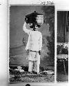 Man carrying vessel on his head