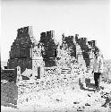 Man stands in front of ancient structure