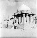 Man stands in front of ancient structure