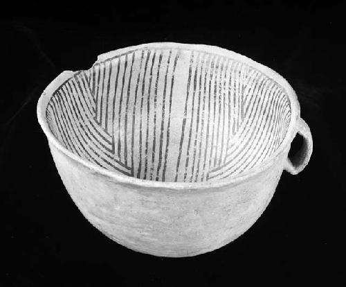 Bowl or cup with small handle and chip on top