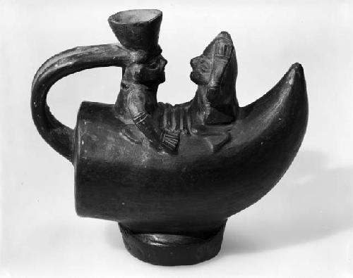 Chimu vessel depicting reed fishing raft and human form