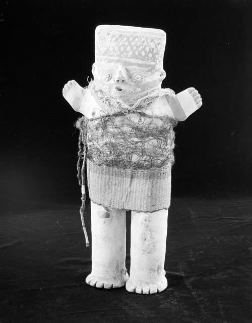 Female human effigy figure with woven garment