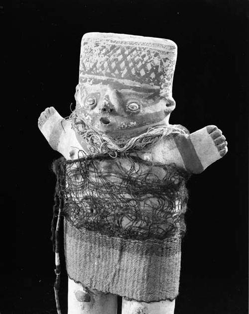 Female human effigy figure with woven garment