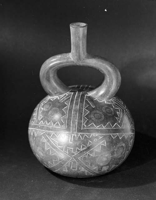 Stirrup pot; black with flat bottom and two incised designs on surface