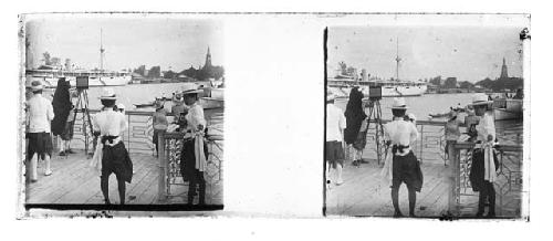 stereo glass slides of Siam; men on dock with camera