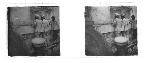 stereo glass slides of Siam; uniformed men overlooking wall