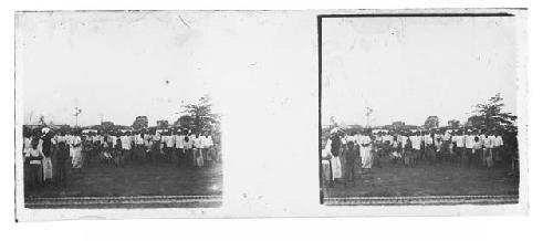 Stereo glass slides of Siam; crowd of men in white coats gathered outdoors