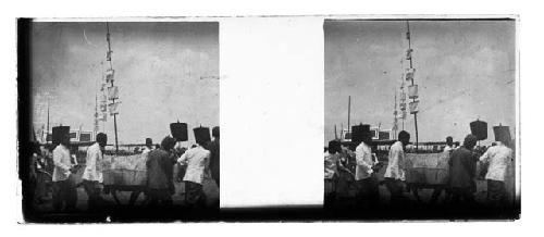 stereo glass slides of Siam; men in white coats carrying banner