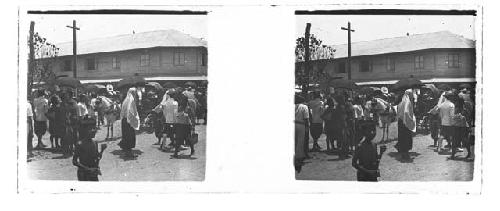 stereo glass slides; street crowd, woman in shawl, boy in foreground