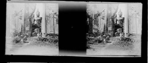 stereo glass slides; person looking at large buddha statue at ruins