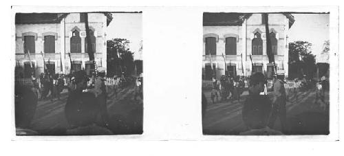 stereo glass slides; men marching in town center