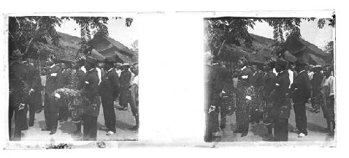 stereo glass slides; men in dark suits and traditional hats watching events