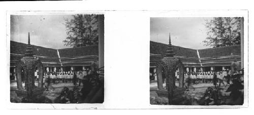 stereo glass slides; group standing in plaza of building