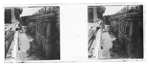 stereo glass slides; looking down street with people, buildings on left