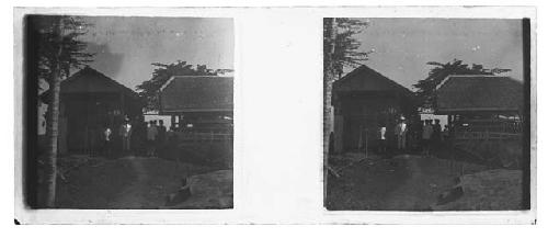 stereo glass slides; group of people standing near rural out buildings