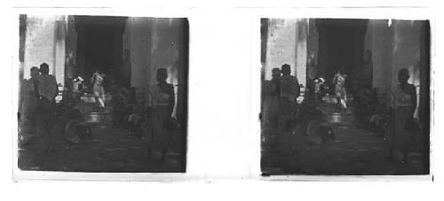 stereo glass slides; villagers seated outside entryway