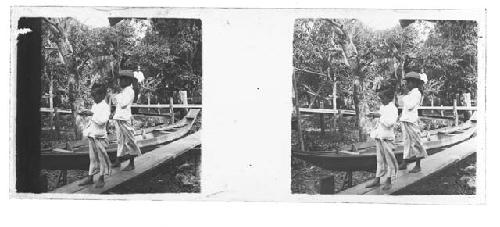 stereo glass slides; two children on boardwalk, boat in background