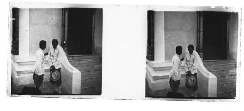 stereo glass slides; two men in white coats conferring outside stoop