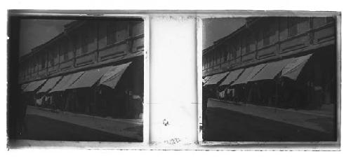 stereo glass slides; awnings outside merchant building