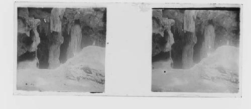 stereo glass slides; cave with figurine perched on left