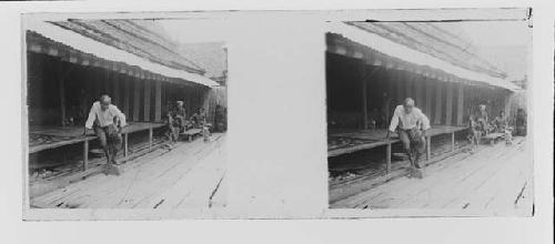 stereo glass slides; old man seated on clapboard platform, onlookers