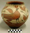 Ceramic jar, polychrome bird motif exterior, scalloped rim, depressed base